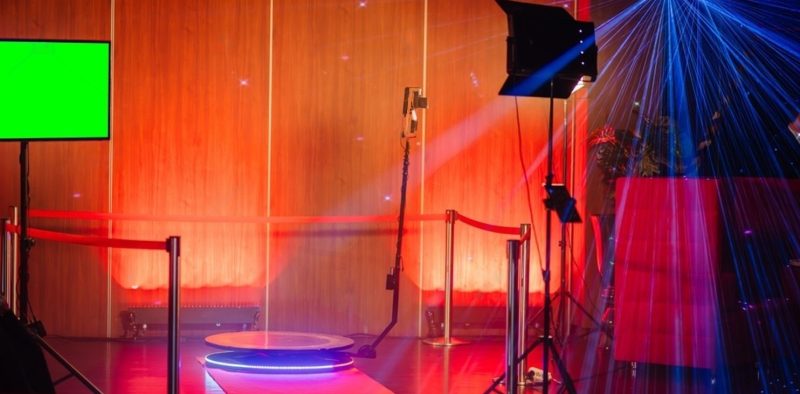 stock-photo--degree-spinner-photo-booth-setup-with-colorful-laser-lights-a-green-screen-and-a-camera-on-a-2414291089-transformed